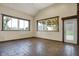 Bright, spacious living room with large windows and rustic flooring at 5442 W 400 N, Fairland, IN 46126