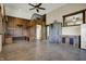 Expansive living room boasts a high ceiling, concrete floors, unique wooden accents and a rustic style at 5442 W 400 N, Fairland, IN 46126