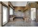 Rustic mudroom features a custom wood bench, hooks and access to a full bathroom at 5442 W 400 N, Fairland, IN 46126