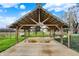 Covered wooden pavilion featuring a concrete floor, high ceilings, and a metal roof at 5442 W 400 N, Fairland, IN 46126