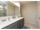 Bathroom featuring a double sink vanity with quartz countertops, and walk-in shower at 5694 Walkabout Way, Brownsburg, IN 46112