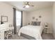 Cozy bedroom with a ceiling fan, natural light, and decorative wall art at 5694 Walkabout Way, Brownsburg, IN 46112