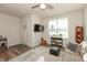 Inviting living room featuring wood floors, a ceiling fan, and stylish decor that extends a homey feel at 5694 Walkabout Way, Brownsburg, IN 46112