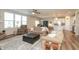 Spacious open-concept living room blending seamlessly with the kitchen and dining areas, ideal for modern living at 5694 Walkabout Way, Brownsburg, IN 46112