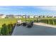 Relax on the spacious backyard patio with comfortable seating and a grilling area at 5694 Walkabout Way, Brownsburg, IN 46112