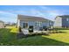 Enjoy this home's backyard patio with a built-in grill and lovely outdoor seating at 5694 Walkabout Way, Brownsburg, IN 46112