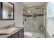 Updated bathroom featuring a glass-enclosed shower, granite vanity, and modern fixtures at 594 N Shore Blvd, Franklin, IN 46131