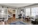 Inviting living room featuring barn doors, natural light, and modern decor on stylish wood flooring at 594 N Shore Blvd, Franklin, IN 46131