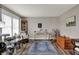 Comfortable living room showcasing a large window, decor accents, rug, and hardwood floors at 594 N Shore Blvd, Franklin, IN 46131