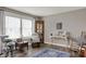 Cozy living room with large windows, a sitting chair, a table and stylish decor on hardwood floors at 594 N Shore Blvd, Franklin, IN 46131