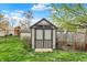 Backyard storage shed provides extra space for tools and equipment, enhancing organization and functionality at 594 N Shore Blvd, Franklin, IN 46131