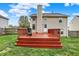 Large backyard features a spacious deck with a grill, perfect for outdoor entertaining at 6064 Brandermill Rdg, Columbus, IN 47203