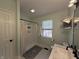 Well-lit bathroom with a shower, neutral color scheme, and modern finishes at 6064 Brandermill Rdg, Columbus, IN 47203