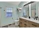 Modern bathroom with a double sink vanity, updated fixtures, and stylish finishes at 6064 Brandermill Rdg, Columbus, IN 47203