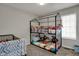 Cozy bedroom with a bunk bed, ample space for play, and natural light at 6064 Brandermill Rdg, Columbus, IN 47203