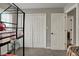 Functional bedroom with closet space, a door to the hallway, and a modern bunkbed at 6064 Brandermill Rdg, Columbus, IN 47203
