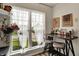 Inviting breakfast nook with natural light offers a cozy spot, perfect for enjoying morning coffee or casual meals with a view at 6064 Brandermill Rdg, Columbus, IN 47203