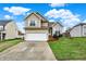 Charming two-story home features a well-maintained lawn and a two-car attached garage at 6064 Brandermill Rdg, Columbus, IN 47203