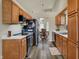 Well-lit kitchen with wood cabinets, stainless steel appliances, and neutral countertops offers a practical and stylish cooking space at 6064 Brandermill Rdg, Columbus, IN 47203