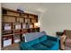 Comfortable seating area featuring built-in bookshelves filled with books and decorative items at 6064 Brandermill Rdg, Columbus, IN 47203
