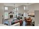 Open-concept living and dining area with a fireplace, hardwood floors, and natural light at 6064 Brandermill Rdg, Columbus, IN 47203