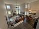 Bright living area with tall ceilings, a cozy fireplace, and elegant furnishings at 6064 Brandermill Rdg, Columbus, IN 47203