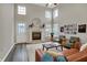 Bright living room with fireplace, comfortable seating, and lots of natural light, perfect for relaxing at 6064 Brandermill Rdg, Columbus, IN 47203