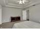 Spacious bedroom with a tray ceiling, neutral decor, and comfortable carpeting at 6064 Brandermill Rdg, Columbus, IN 47203