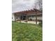 Inviting backyard patio area with wood pergola, perfect for outdoor dining and entertaining at 6426 Maple Lawn Rd, Indianapolis, IN 46241