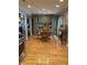 Dining area featuring hardwood floors, wood table and chairs, and a view to other room at 6426 Maple Lawn Rd, Indianapolis, IN 46241