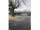 Charming single-story home features a brick facade, an attached garage, and a paved driveway at 6426 Maple Lawn Rd, Indianapolis, IN 46241