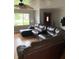 Cozy living room featuring hardwood floors, a ceiling fan and large sectional sofa at 6426 Maple Lawn Rd, Indianapolis, IN 46241