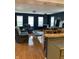 Inviting living room features hardwood floors, wood stove, and plenty of natural light at 6426 Maple Lawn Rd, Indianapolis, IN 46241