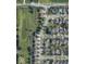 An aerial view displays the proximity to a neighborhood playground and pond at 6518 Sonesta Dr, Indianapolis, IN 46217