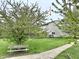 Lush backyard view with a green lawn, framed by mature trees offering shade and tranquility at 6518 Sonesta Dr, Indianapolis, IN 46217