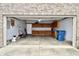 Spacious two-car garage with ample storage cabinets, providing functional space for parking and organization at 6518 Sonesta Dr, Indianapolis, IN 46217
