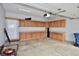 Functional garage with extensive cabinet storage, offering ample space for vehicles and organizational needs at 6518 Sonesta Dr, Indianapolis, IN 46217