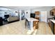Open kitchen with a center island and a view of the adjacent living room, perfect for entertaining at 6518 Sonesta Dr, Indianapolis, IN 46217