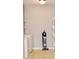 Well-lit laundry area with washer, dryer, and shelving, offering practical storage and convenience at 6518 Sonesta Dr, Indianapolis, IN 46217