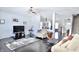Spacious living room features dark floors, neutral walls, and an open layout connecting to other living spaces at 6518 Sonesta Dr, Indianapolis, IN 46217