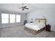 Spacious main bedroom with carpet floors, ceiling fan, and lots of natural light at 6518 Sonesta Dr, Indianapolis, IN 46217