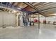 Unfinished basement with visible ceiling beams, concrete walls, and ample space for storage or customization at 7391 Blanford Dr, Plainfield, IN 46168