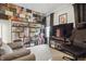 Cozy bedroom with creative wall decor, shelving with collectables, and comfortable seating at 7391 Blanford Dr, Plainfield, IN 46168