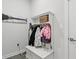 White entryway cabinet with space for coats and shoes adding functionality to the home at 7391 Blanford Dr, Plainfield, IN 46168