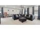 Comfortable living room with large sectional sofa, plenty of natural light at 7391 Blanford Dr, Plainfield, IN 46168