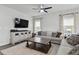 Comfortable living room featuring a plush sofa, accent lighting, and modern decor at 7391 Blanford Dr, Plainfield, IN 46168