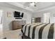 Main bedroom with tray ceiling, TV, and ample storage showcases modern comfort at 7391 Blanford Dr, Plainfield, IN 46168