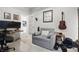 Functional home office setup with desk, comfortable seating, and view into kitchen at 7391 Blanford Dr, Plainfield, IN 46168