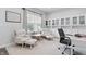 Inviting office featuring comfortable seating, natural light, and built-in bookshelves at 7391 Blanford Dr, Plainfield, IN 46168