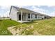 Backyard view highlighting the covered patio and lawn area of the property at 745 Stone Trace Ct, Avon, IN 46123
